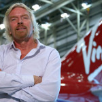 Richard Branson in front of a Virgin plane